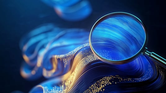 A magnifying glass focuses on swirling blue and gold patterns, symbolizing discovery and analysis of data.